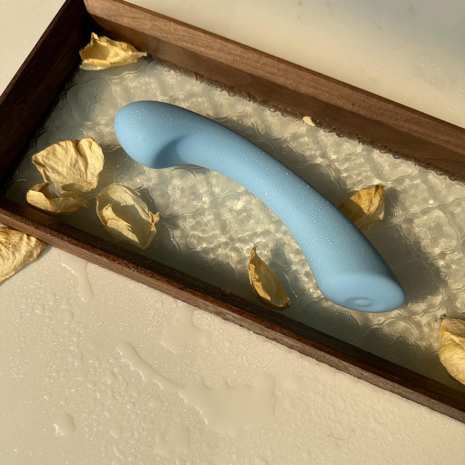 Crescent-shaped G-spot vibrator